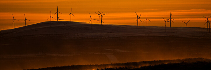 Sunset and wind farm