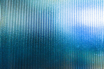 Close up of corrugated glass texture with reflected,modern home decor,stylish home decor,Creative composition of living room,Wave glass vertical line pattern,Template,copy space.