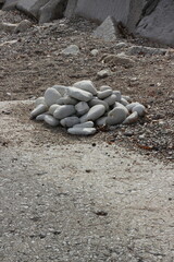 A pile of found rocks on the rocky beach.