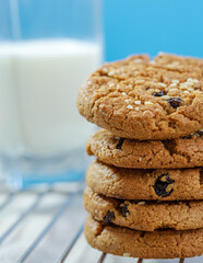 Oats Cookies biscuits with a glass of milk on a metal grid