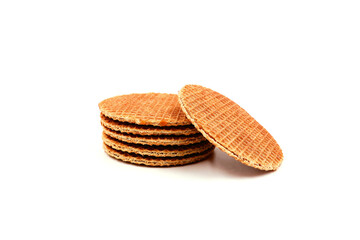 Dutch stroopwafels stacked up isolated on a white background. Waffles filled with syrup.