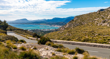 A road among the mountains on the Formentor peninsula in Mallorca. In the background the sea and mountains