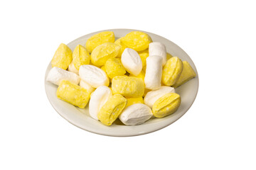 Famous traditional Turkish white and yellow Mevlana candy (in Turkish: Mevlana Şekeri ) in white plate isolated on a white background. The local confectionery product in Konya, Turkiye. Close up shot