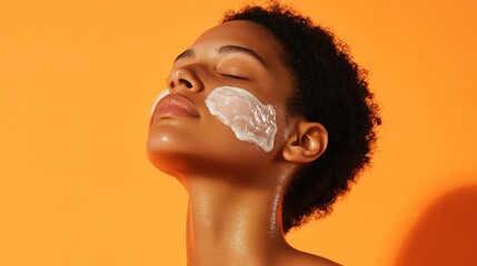 Woman applying face cream enjoys skincare routine