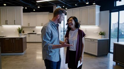 Couple Excitedly Selecting Custom Cabinets Together