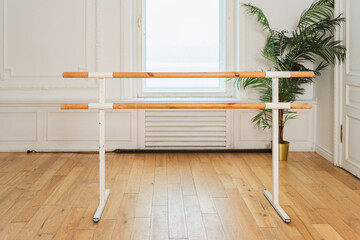 Empty ballet dance studio with barre. Professional ballet barre for stretching practicing dancing positions in dance school Dance hall ready for ballet class training. Ballet school