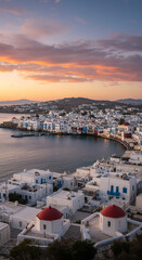 Fototapeta premium Mykonos Magic: Sunrise Over White Houses & Red Domes - A Greek Island Dreamscape! Explore Cycladic Charm & Aegean Beauty.