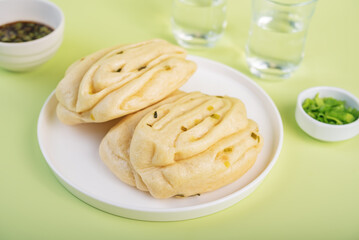 Asian scallion buns in a plate