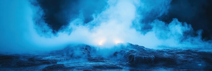 Obraz premium A serene, misty landscape illuminated by soft blue hues, creating an atmospheric and mysterious ambiance.