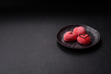 Delicious sweet mochi in the shape of red hearts