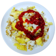 A plate with scrambled eggs with a tomato sauce called ketchup.