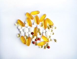 Assorted Pills and Capsules on White Background