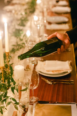 Celebrating a special occasion with champagne and candlelight during an elegant dinner party