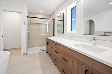 Bathroom with a shower stall and two sinks
