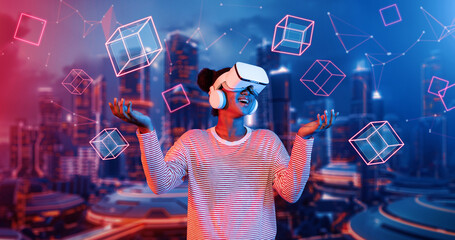 African girl wearing VR glasses and casual cloth while standing at futuristic city. Attractive gamer playing game while using augmented reality technology accessing in metaverse. AI concept Ingenuity. © InfiniteFlow