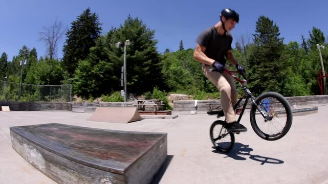 BMX rider 180 onto a ledge 180 off
