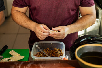 close up of a man preparing food