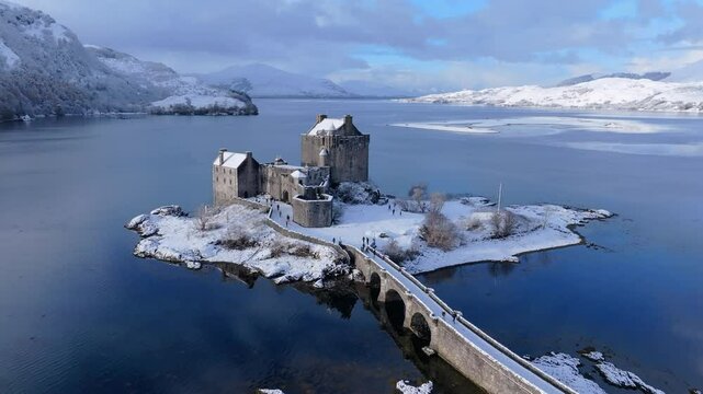Snowy morning at Eilean Donan Castle on Loch Duich, Dornie, Western Highlands, Scotland, United Kingdom