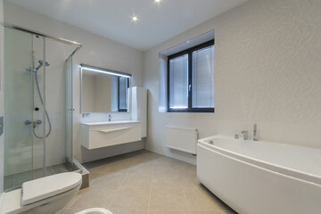 Bathroom with white interior decor. Shower cabin with glass partition. Blinds on the .window.