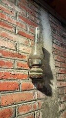 Vintage Dusty Lantern on Exposed Brick Wall – Classic Rustic Lamp with Antique Design, Retro Home...
