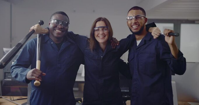 Happy, rage room and face of friends with bat for breaking objects, vandalism and destruction. Weapon, demolition and portrait of men and woman with safety glasses for protection for property damage