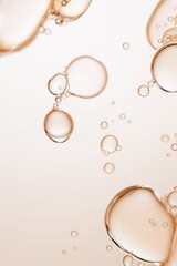 Golden Bubbles Abstract: An abstract close-up showcasing a collection of translucent golden bubbles suspended in a liquid, creating a mesmerizing and elegant visual effect.