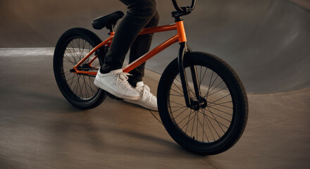 Naklejka premium BMX bike rider performing tricks in a skatepark setting