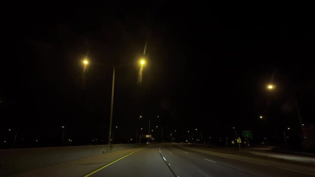 Driving on empty highway at night time. Wide POV wide view