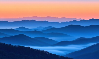 Obraz premium Misty mountain range at sunrise, with soft hues of orange and pink blending into the cool blue sky, creating a tranquil and breathtaking view
