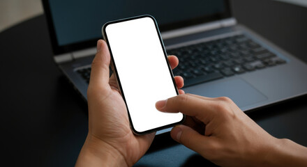 Hand holding a smartphone with a blank screen, ideal for mockup presentations