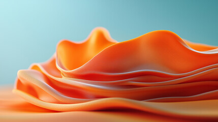 Obraz premium Textured orange fabric draping elegantly to create a wavy surface against a soft blue background