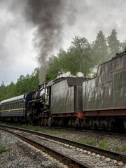 Fototapeta premium Train with smoke coming out of it