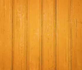 Rustic yellow wooden background with vertical planks and a weathered texture.