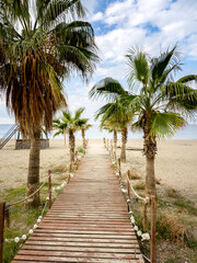 Wooden walkway leads to the beach