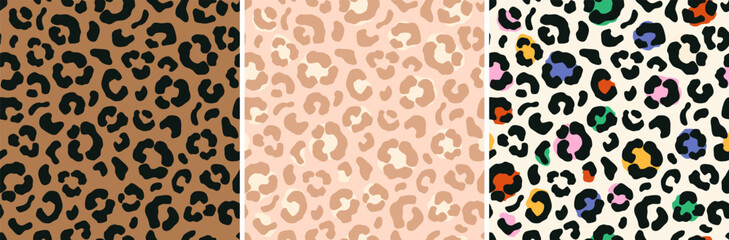Vector set of leopard skin seamless patterns in brown, peach and rainbow colors.
