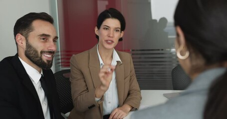 Group of multiethnic business partners closing deal, shake hands after negotiations in boardroom. Female applicant handshaking HR managers, successfully passed interview, get hired, receive job offer