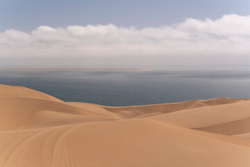 Footprints in the sand, washed away by the tide