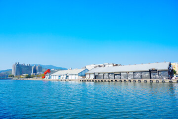 Fototapeta premium Kaohsiung, Taiwan, Republic of China, 01 25 2024: The landscape of Kaosiung pier 2 harbor and downtown
