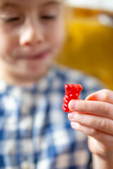 small child, girl 5 years old wants eat gelatinous sweets, gummy bear, happy childhood, sweet life, unhealthy food, halal food