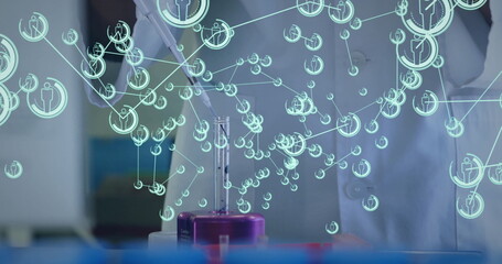 Image of scientist in lab coat analyzing digital data overlay with futuristic graphics