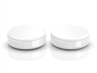 Two white round cosmetic containers with lids on a surface