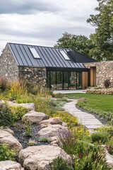 Fototapeta premium A contemporary stone house featuring a sleek metal roof rests gracefully within a vibrant garden, embraced by a picturesque natural landscape under the warm glow of an autumn afternoon