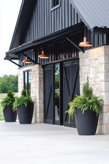 Obraz premium A contemporary and chic building stands proudly, adorned with spacious planters at its entrance. The bright daylight and clear blue sky create a tranquil outdoor atmosphere