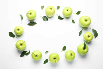 Frame made of fresh apples and green leaves on white background, flat lay. Space for text