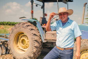 Portrait of a Latino man politely greeting the camera.
