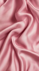 Obraz premium Soft pink linen bed sheets lay gracefully in a gentle swirl, inviting comfort and relaxation. The luxurious texture enhances any bedroom decor, promoting restful sleep
