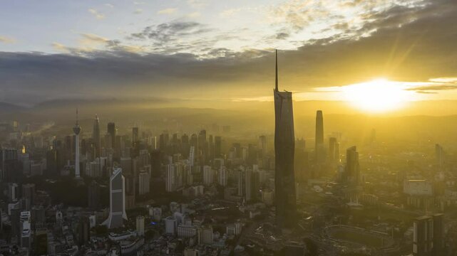 Aerial view time lapse 4k video of Kuala Lumpur city center view during dawn overlooking the city skyline in Federal Territory, Malaysia. Zoom in