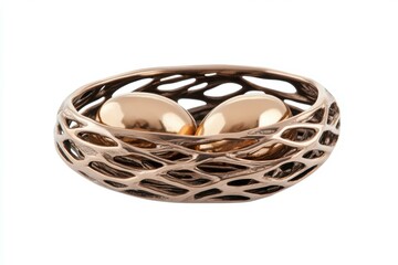Gold and silver bird cage with two eggs inside