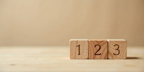 Simple Wooden Blocks Displaying Sequential Numbers One Two Three on a Light Brown Surface