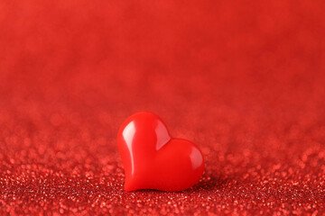 Fototapeta premium Decorative heart on shiny red background. Happy Valentine's day